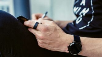 a person writing on a blackboard