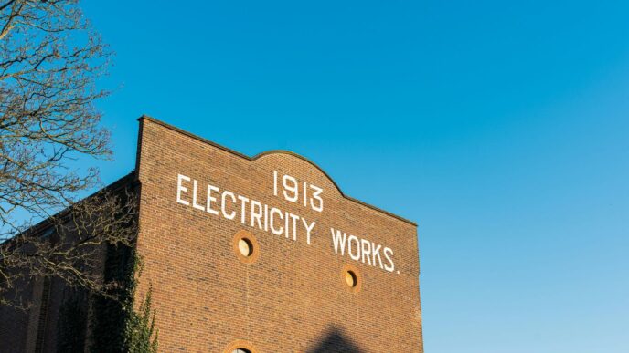 A brick building with a sign that says electricity works