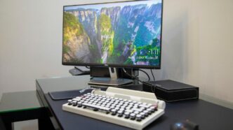 black flat screen computer monitor on white computer keyboard