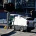 Street sweeper cleaning a city intersection