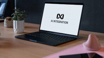Laptop displaying ai integration logo on desk