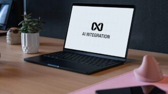 Laptop displaying ai integration logo on desk