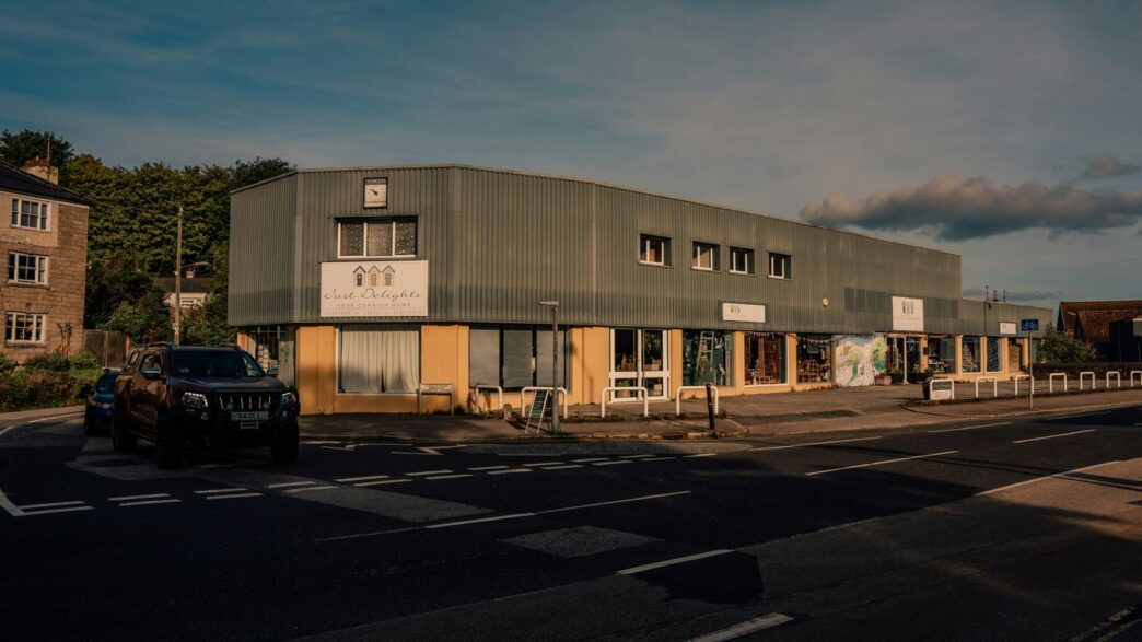 a large building sitting on the side of a road