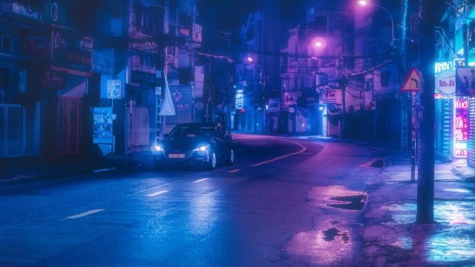 black car on road during night time