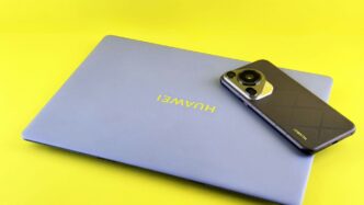Laptop and smartphone on a yellow background