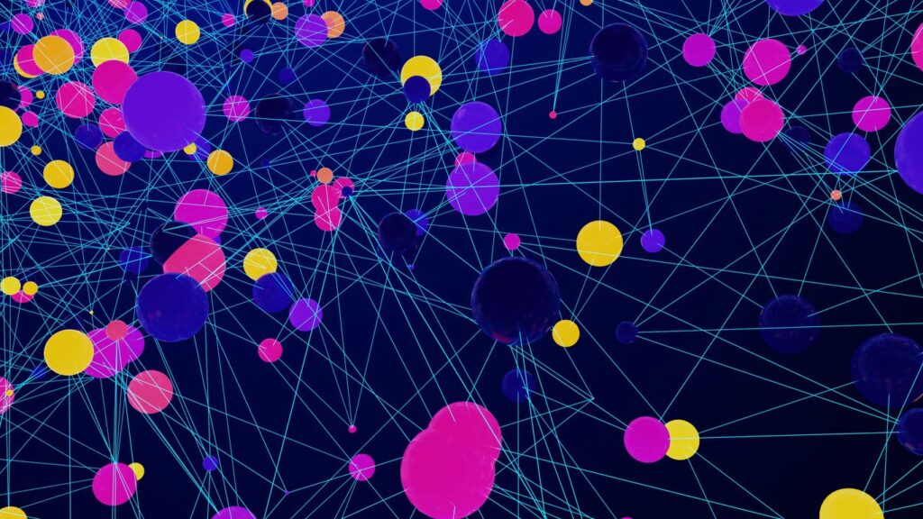 a large group of colorful balls floating in the air