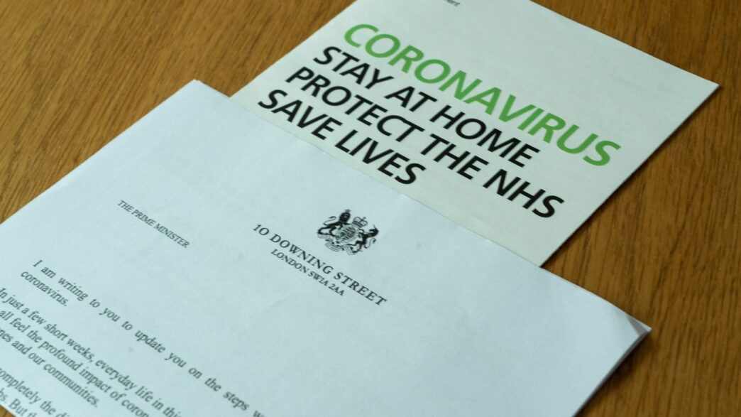 white printer paper on brown wooden table