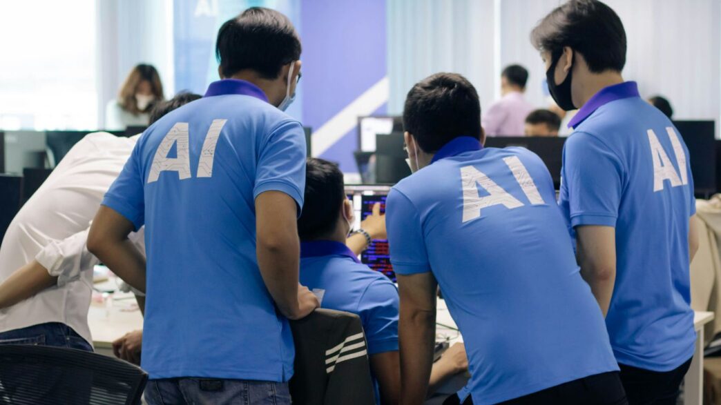 man in blue nike crew neck t-shirt standing beside man in blue crew neck t