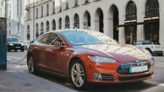 blue porsche 911 parked on sidewalk during daytime