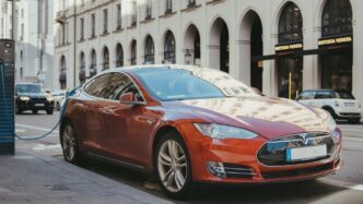 blue porsche 911 parked on sidewalk during daytime