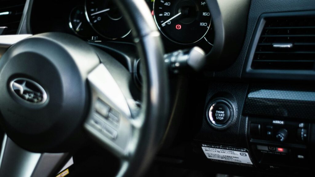 black and gray car steering wheel