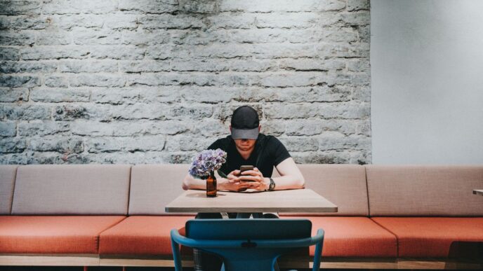 man looking at his cellphone