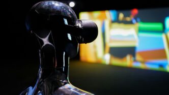 a close up of a robot looking at a screen