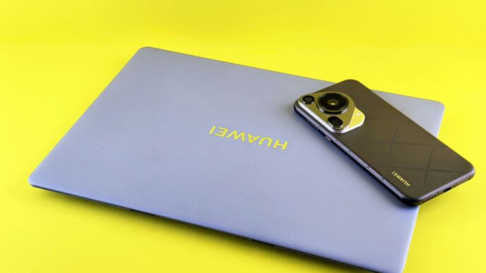 Laptop and smartphone on a yellow background