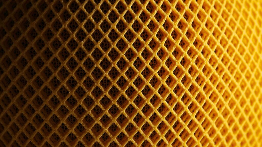 a close up view of a yellow fabric