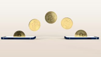 a bunch of coins flying out of a cell phone