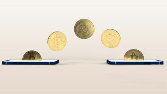 a bunch of coins flying out of a cell phone