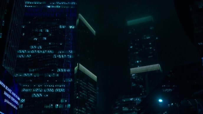 Dark skyscrapers light up the night sky.