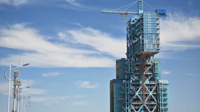 a tall building with a crane on top of it