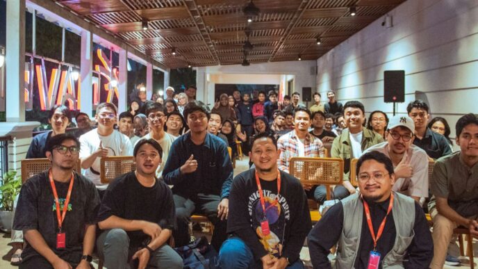 A diverse group of people gathered indoors for an event.