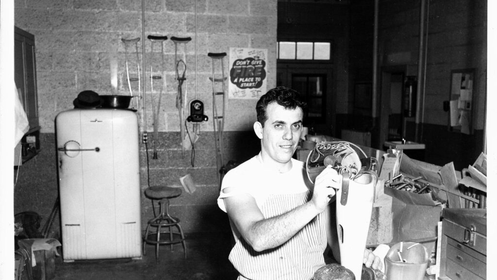 Man working in an artificial limb shop.