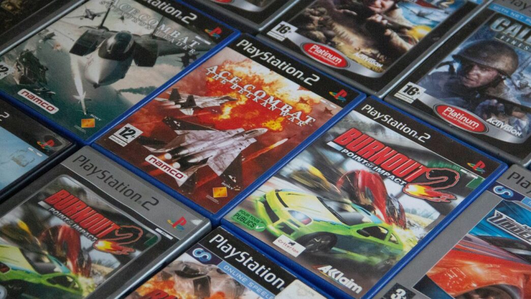 a pile of video games sitting on top of a table