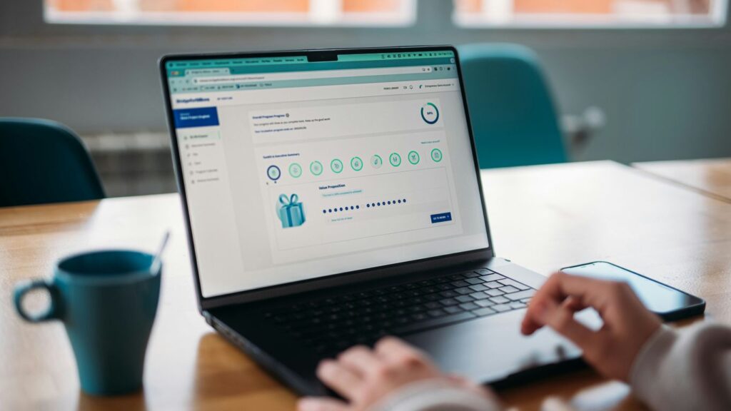 Person using a laptop to review a rewards program.