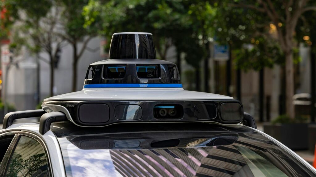 Self-driving car with sensors on city street