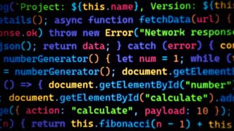 Colorful code scrolls across a dark background.