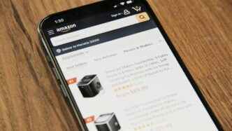 a cell phone sitting on top of a wooden table