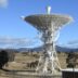 white satellite dish on green grass field during daytime
