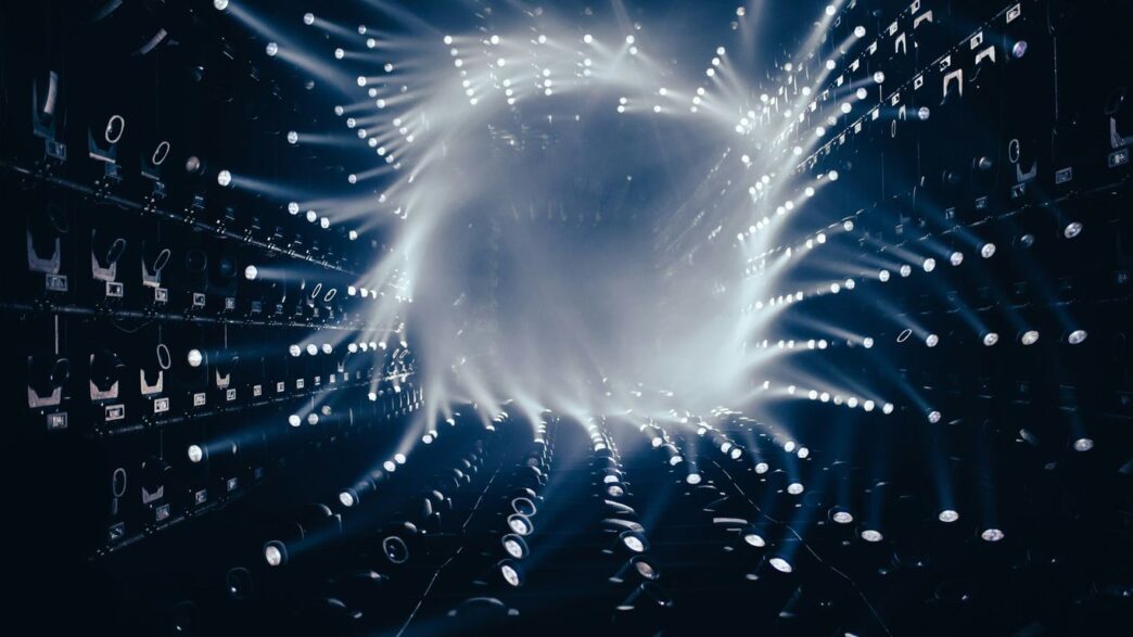 a dark room filled with lots of white lights