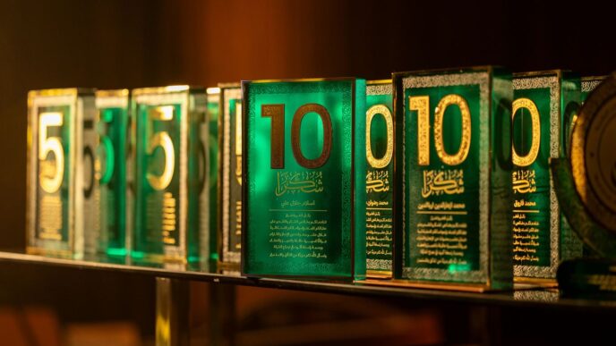 Row of green awards with numbers five and ten