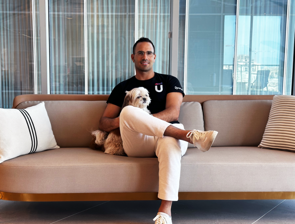 man sitting on chair with legs crossed