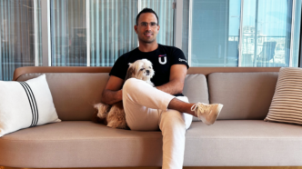 man sitting on chair with legs crossed